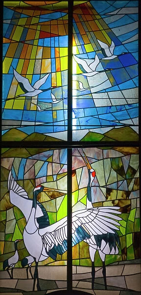 Stained glass window in church near Akan Hokkaido depicting Japanese Cranes