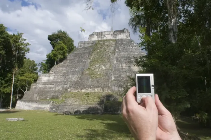 Framed Print : Tourist using a digital camera to photograph a Mayan temple at Yaxha nr Tikal Guatemala Framed Print : Tourist using a digital camera to photograph a Mayan temple at Yaxha nr Tikal Guatemala