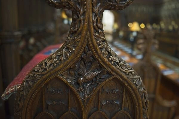 Victorian pew end depicting small bird Gloucester cathedral