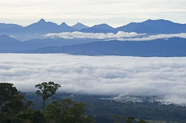 View from Magic Mountain Lodge across cloud covered valley towards Mt Hagen in Western
