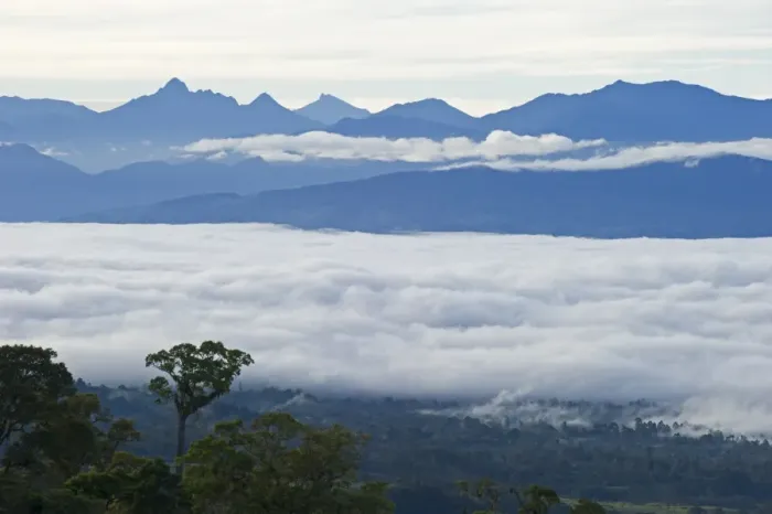Framed Print : View from Magic Mountain Lodge across cloud covered valley towards Mt Hagen in Western Framed Print : View from Magic Mountain Lodge across cloud covered valley towards Mt Hagen in Western