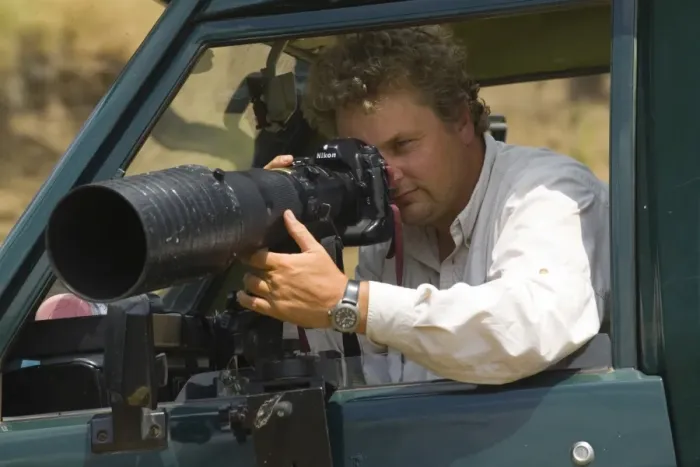 Framed Print : Wildlife photographer David Tipling photographing with a telephoto lens from safari Framed Print : Wildlife photographer David Tipling photographing with a telephoto lens from safari