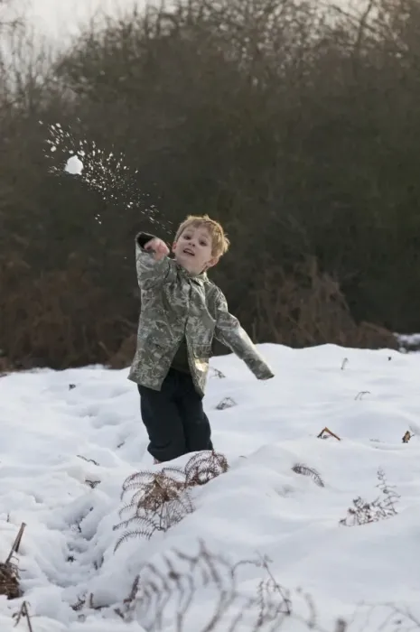 Framed Print : Young boy throws a snowball Kelling Norfolk December Framed Print : Young boy throws a snowball Kelling Norfolk December