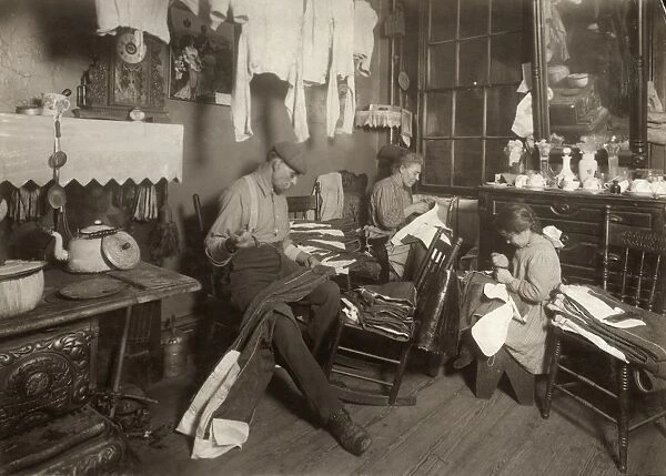 HINE: HOME INDUSTRY, 1913. A mother and father and their nine-year-old daughter