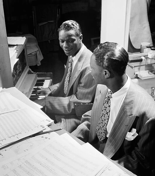 NAT KING COLE (1919-1965). American musician. Photograph by William P. Gottlieb, c1947