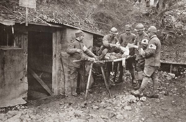 WWI: DRESSING STATION. A wounded Italian soldier being treated by French ambulance