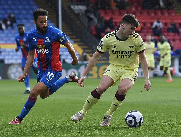 Arsenal's Kieran Tierney Fends Off Andros Townsend Challenge in Crystal Palace Clash