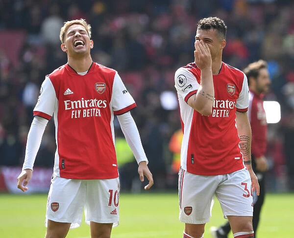 Arsenal's Smith Rowe and Xhaka Celebrate Victory Over Manchester United in 2021-22 Premier League