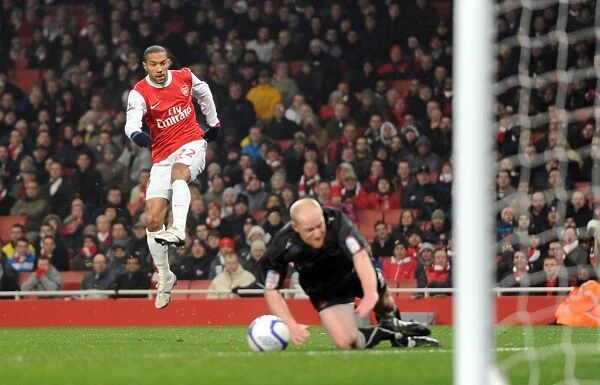 Gael Clichy scores Arsenals 5th goal past Goalkeeper Jamie Jones and under pressure from Andrew Whing (Orient). Arsenal 5: 0 Leyton Orient. FA Cup 5th Round Replay. Emirates Stadium, 2  /  3  /  11. Credit : Arsenal Football Club  / 