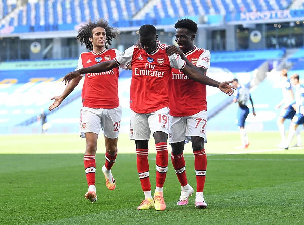 Pepe's Thriller: Arsenal's Triumph at Brighton - A Celebratory Moment with Guendouzi and Saka (2019-20)
