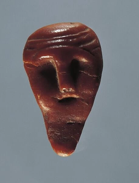 Amber head from Asarps, Sweden