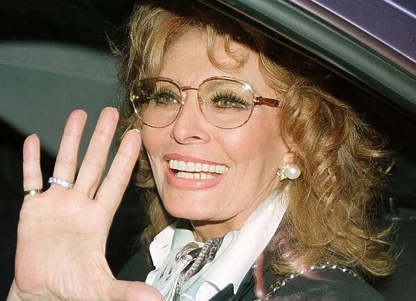 (FILES) -- This file picture shows Italian actress Sophia Loren waving to fans upon