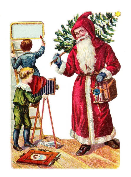 A Victorian Paper Scrap Relief of a boy taking a photograph of Father Christmas, c