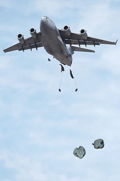 Soldiers jump from a C-17 Globemaster III during a Mobility Air Forces Exercise