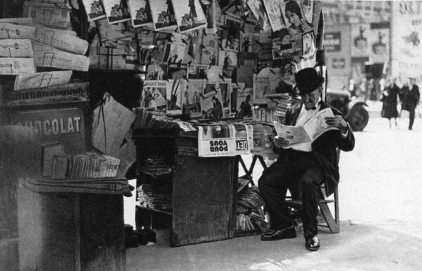 Newspaper stand, Paris, 1931. Artist: Ernest Flammarion