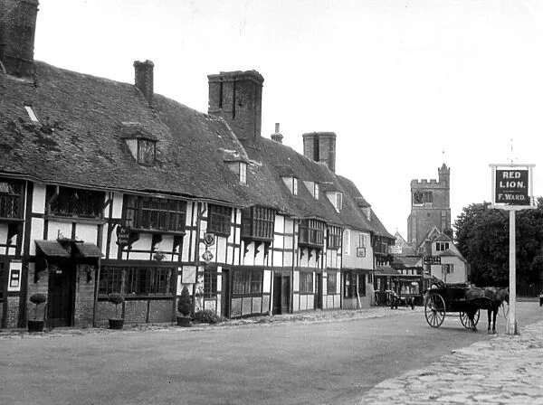 General view of the main street in the village of Biddenden in Kent showing pubs