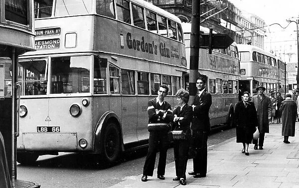 A good time for a chat when trolley bus drivers and a conductress take a break as