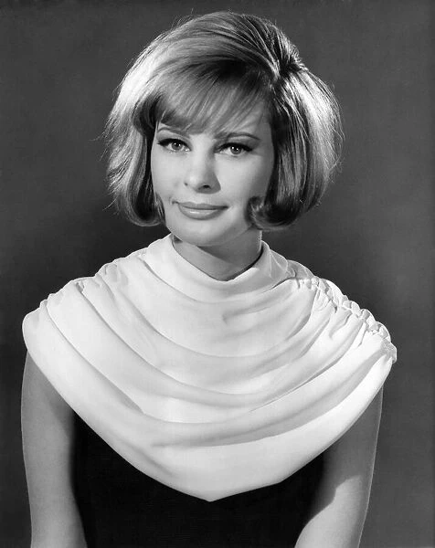 Model wearing a white neck scarf January 1963 P007634