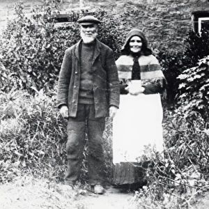 Couple outside cottage, Pembrokeshire, South Wales