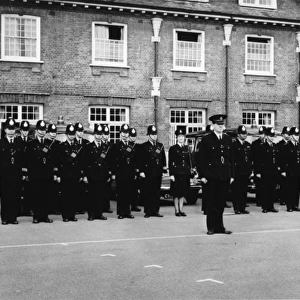 Male and female police officers at an inspection parade