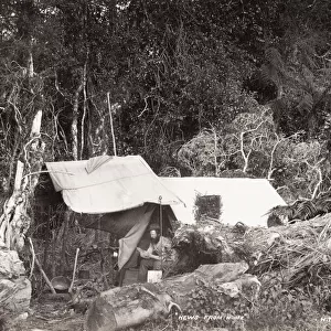 Man in a bush tent, likely New Zealand