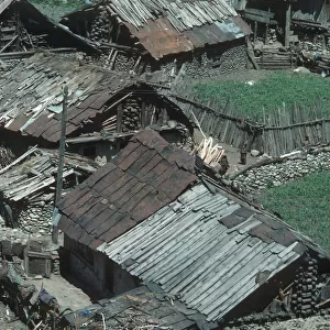 Ramshackle wooden houses alongside the river in Sind Valley