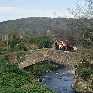 Two riders on Packhorse Bridge, Horner, Somerset