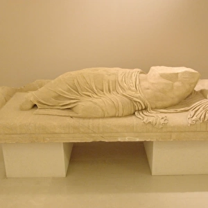 Statue of a reclining man. Greece