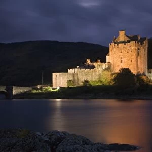 Eilean Donan Castle - being lit up at dusk - November - Scotland