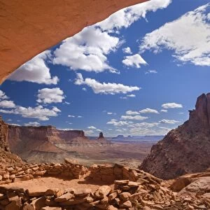 False Kiva - ancient indian ruin tucked into an alcove of rock with a breathtaking panoramic view over canyons and sandtone buttes - Island in the Sky, Canyonlands National Park, Utah, USA