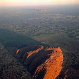 Uluru (Ayers Rock) at sunrise, aerial, Uluru-Kata Tjuta National Park (World Heritage Area), Northern Territory, Australia JPF44471