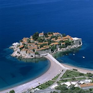 Aerial view over island and sandbar, Sveti Stefan, The Budva Riviera, Montenegro, Europe