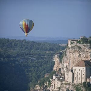 Hot air balloon above the valley at Rocamador in the Dordogne area of the Midi Pyrenees