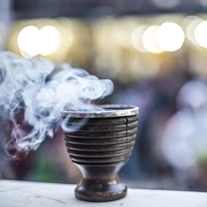Incense burning at a Hindu temple in New Delhi, India, Asia