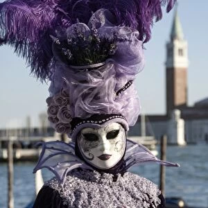 Lady in black and purple mask and feathered hat, Venice Carnival, Venice, UNESCO