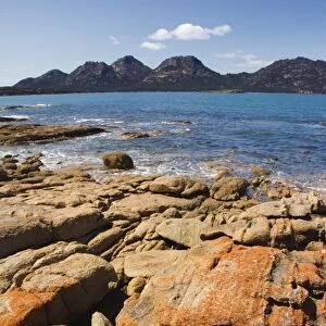 Lichen covered red granite rocks at the Hazards Mountain Range, Coles Bay