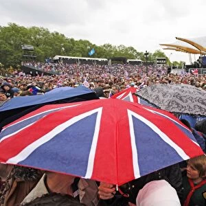 Patriotic crowds with umbrellas at the Queen Elizabeth II Diamond Jubilee Celebrations, London