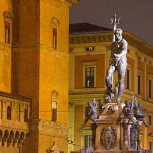Neptune sculpture in the old town of Bologna at twilight