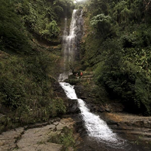 A general view of a waterfall at the Juan Curi natural park near the municipality