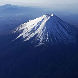 Japans Mount Fuji is seen covered with snow from an airplane