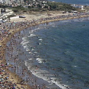 People gather in the Virgen de Regla beach in Chipiona, southern Spain