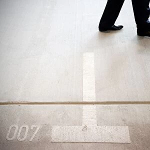 Visitor walks on the car park place numbered 007 at German Federal Intelligence Agency