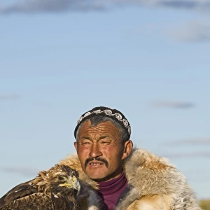Dalai Han an Kazakh eagle hunter with his Golden Eagle Bayan-Ulgii in Altai Mountains