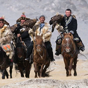 Eagle hunters on route to the Eagle Hunters festival near Ulgii in western Mongolia