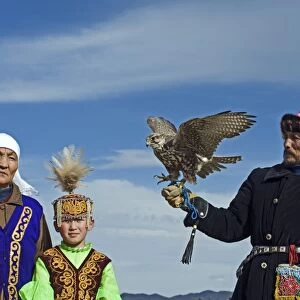Kazakh hunter with Saker Falcon at Eagle hunters festival near Ulgii in western Mongolia