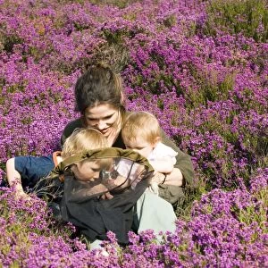 Mother and kids on heath in summer Norfolk UK