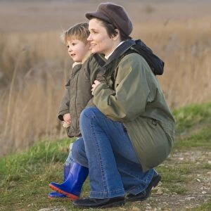 mother and son on bird reserve at Cley Norfolk winter