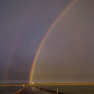 Rainbow over Lindisfarne causeway Holy Island Northumberland autumn