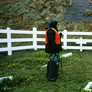 Tourist at Shackletons Grave, Grytviken, South Georgia