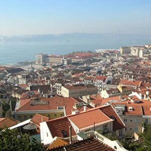 View across city rooftops from castle towards river, Tagus River, Lisbon, Portugal, October